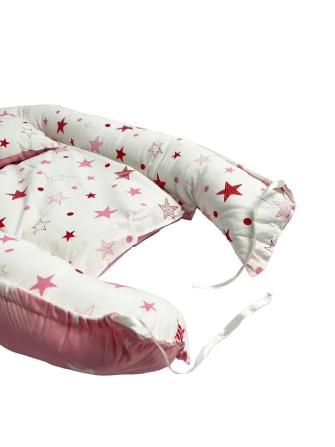 Babynest mit Kissen in Rosa