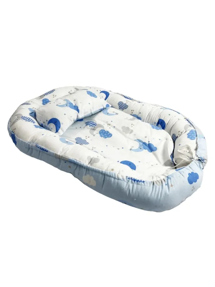 Babynest mit Kissen in Turkis