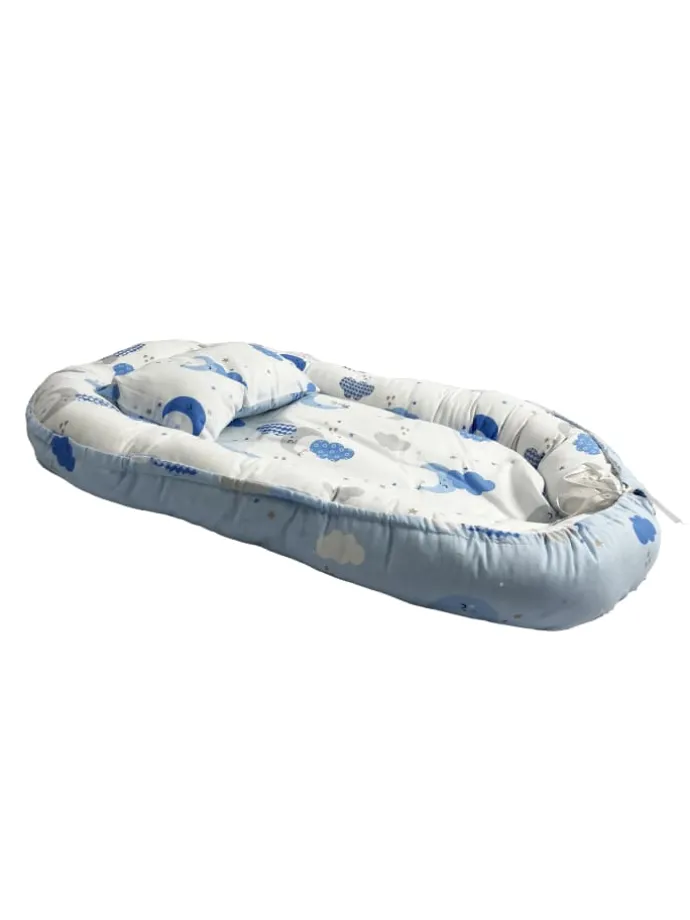 Babynest mit Kissen in Turkis