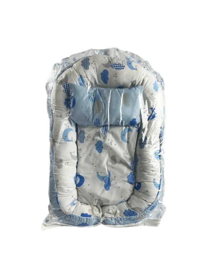 Babynest mit Kissen in Turkis