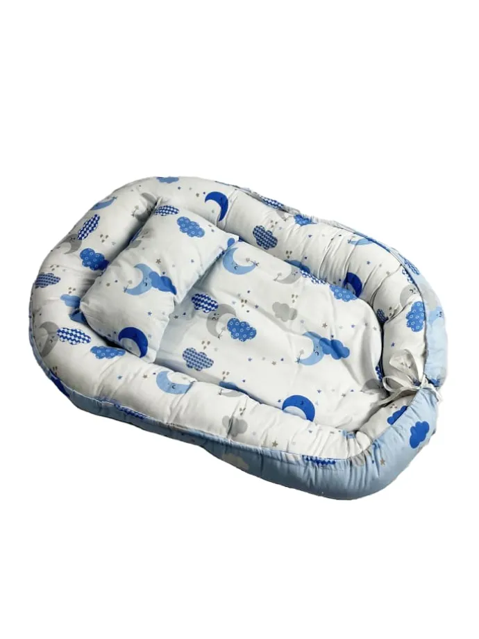 Babynest mit Kissen in Turkis